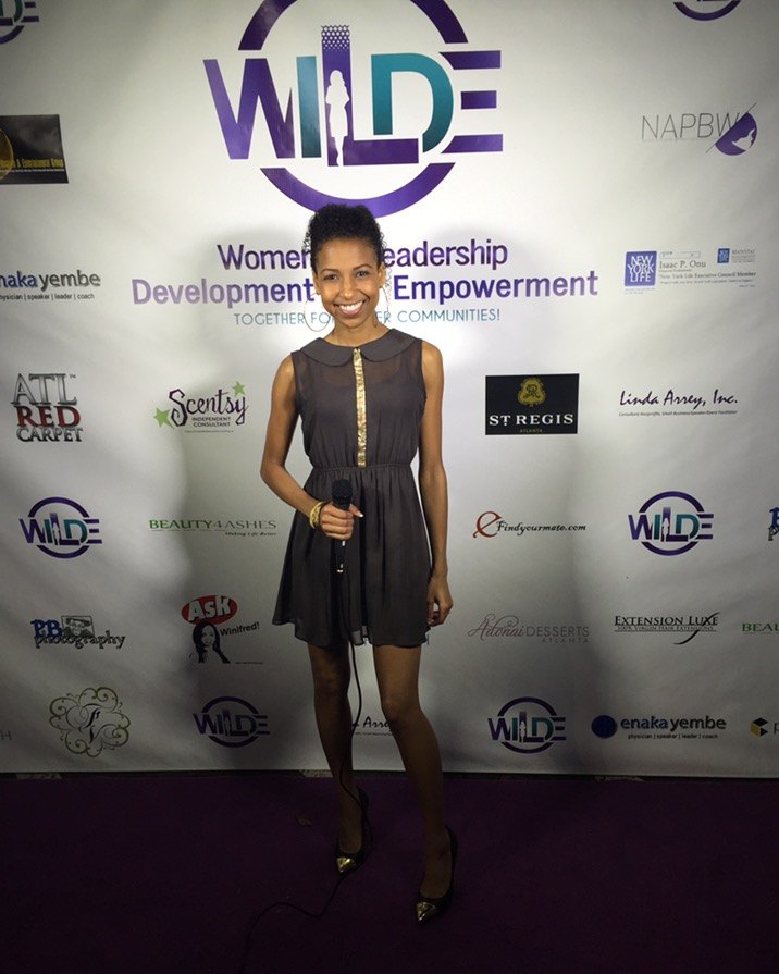 Chelsea with a mic on the WILDE Awards red carpet